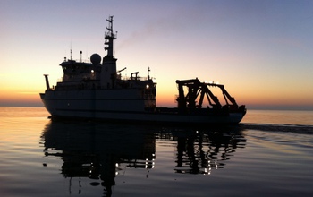 During an October sunrise, R/V Sikuliaq at sea